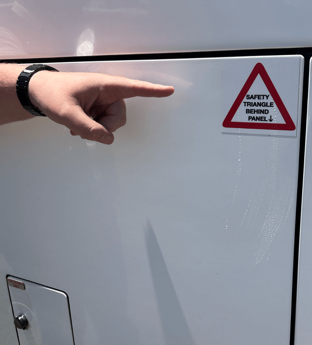 The compartment with the triangle kit has this label